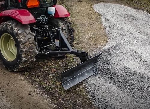 red yanmar grading scraper