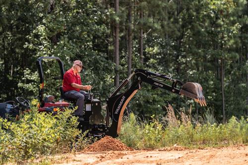 SM240 with digger outstretched