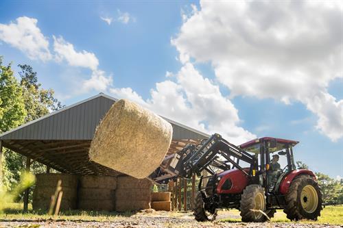 sm475 moving bale to barn